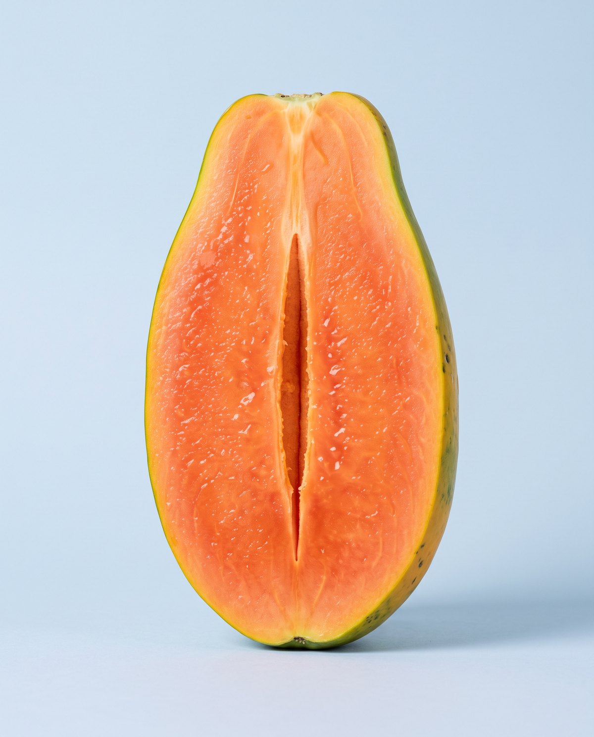 A fresh, juicy papaya half