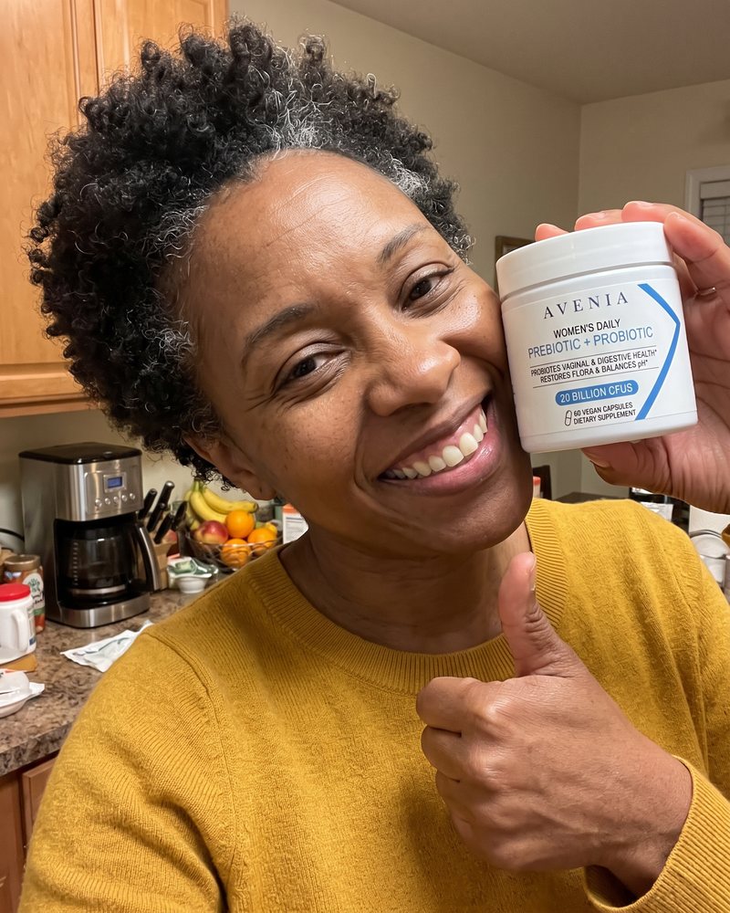 An AVENIA customer holding her jar