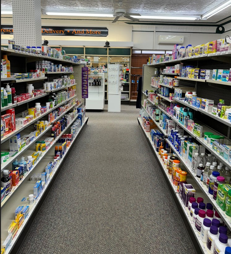 A long drugstore aisle lined with personal care products
